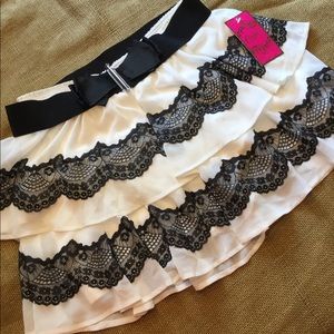 Candie’s black lace and light cream skirt